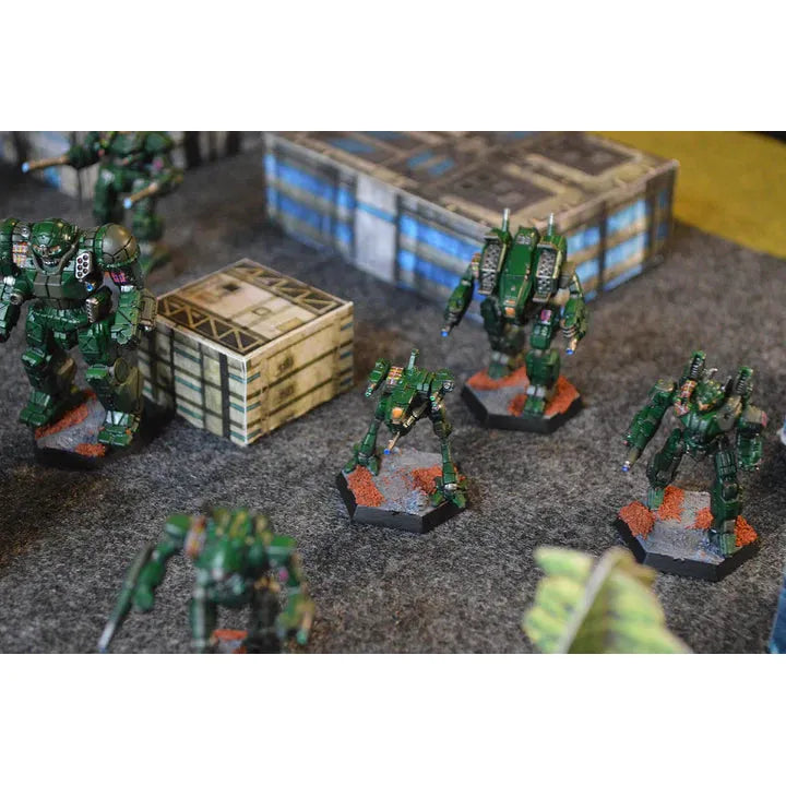 BattleTech: Alpha Strike miniatures on a tabletop battlefield scene.
