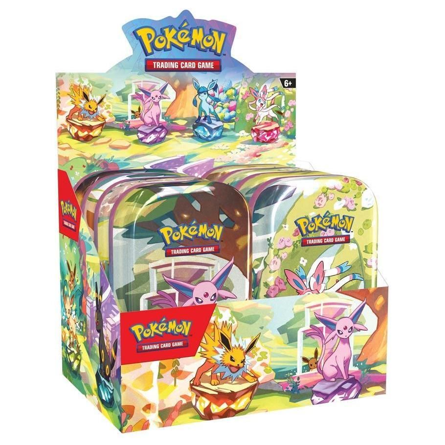 Pokémon TCG Scarlet & Violet Prismatic Evolutions Mini Tin with packs and Eevee coin display.