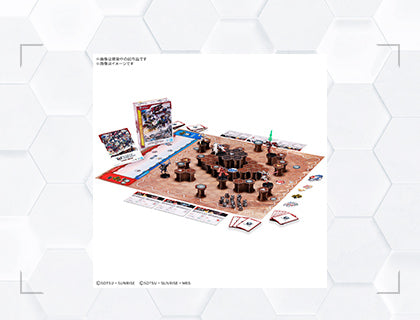 Gundam Assemble Starter Set 01 (ST01) packaging — a complete two-player miniatures game with six unpainted mobile suits