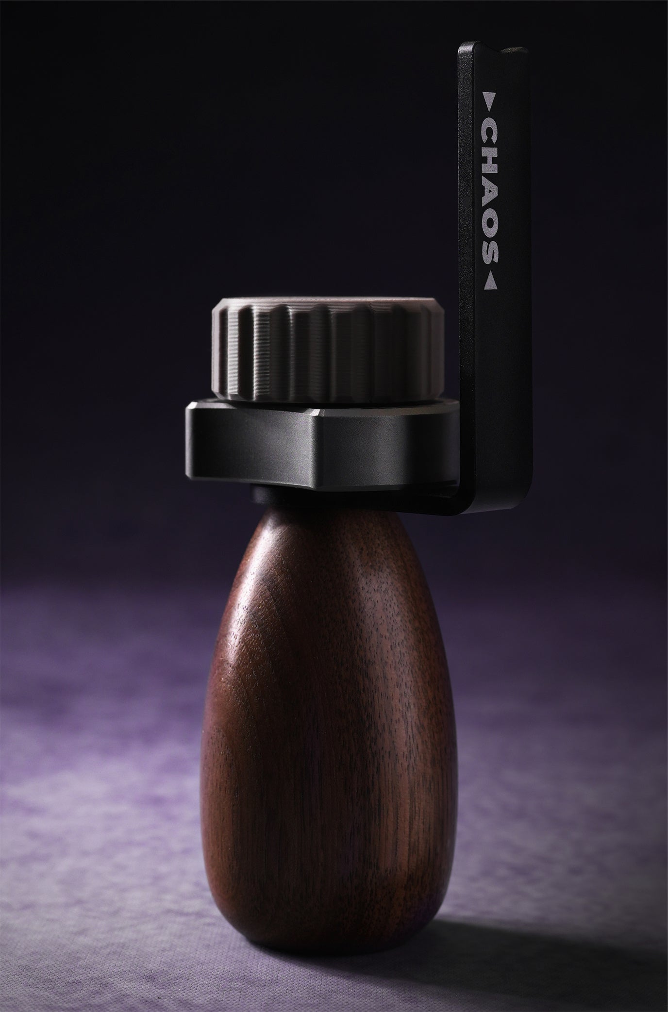 Chaos Painting Handle with ergonomic walnut grip and rotating aluminum base for precision miniatures.